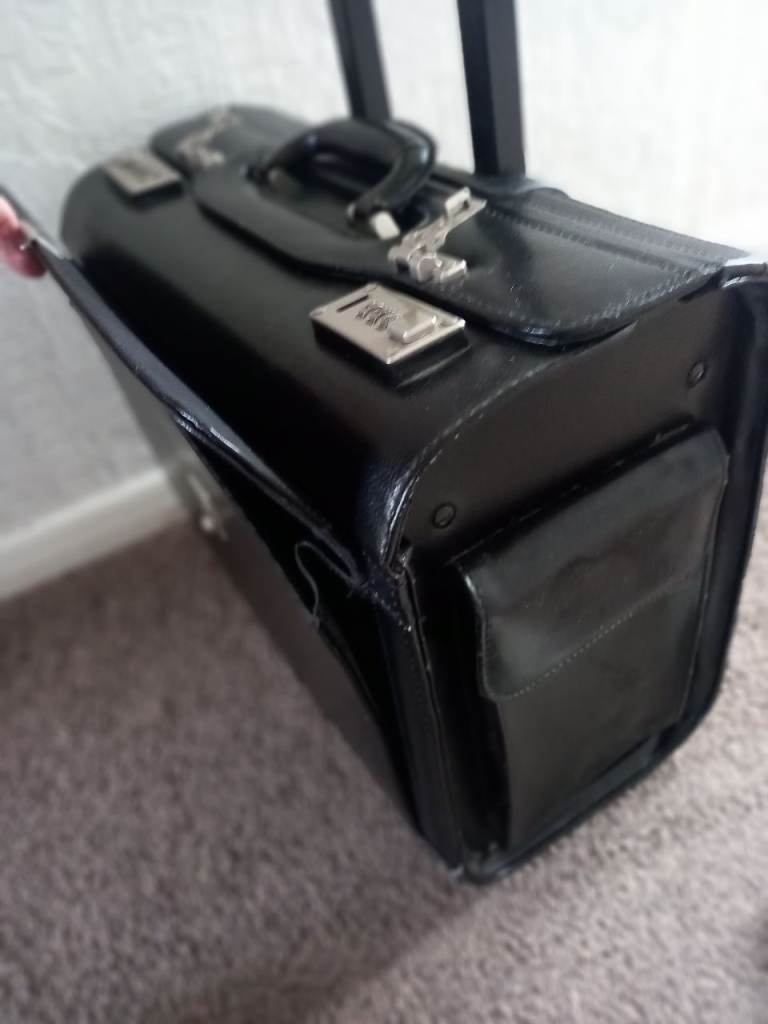 Briefcase, large, leather wheeled briefcase