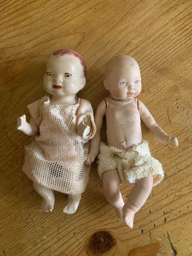 2 vintage dolls, 1 from 1985, 1 eatlier bisque doll