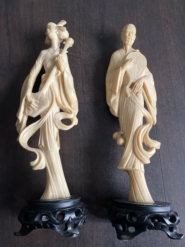 PAIR OF ORIENTAL-STYLE FIGURINES – 17” – FAUX IVORY RESIN 