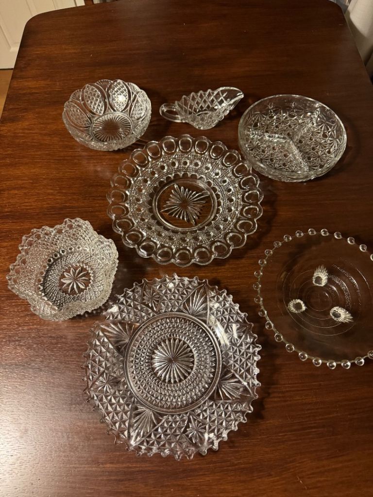 Collection of glass and crystal serving bowls and plates
