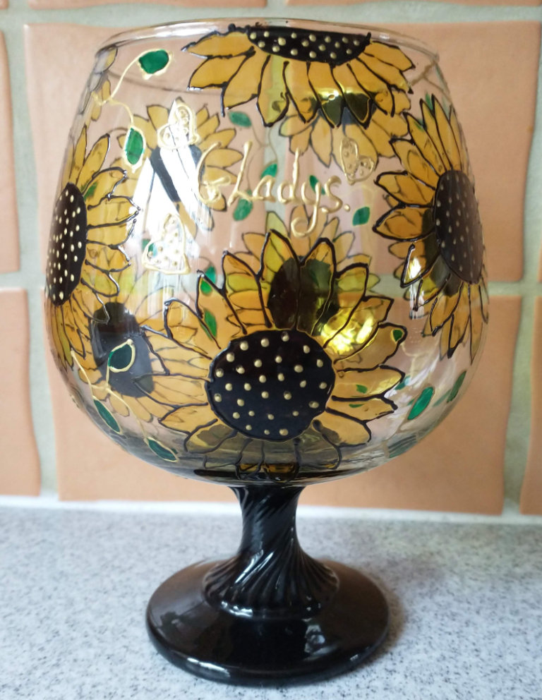 Decorated Hand painted Glass ornament with the name “Gladys.”