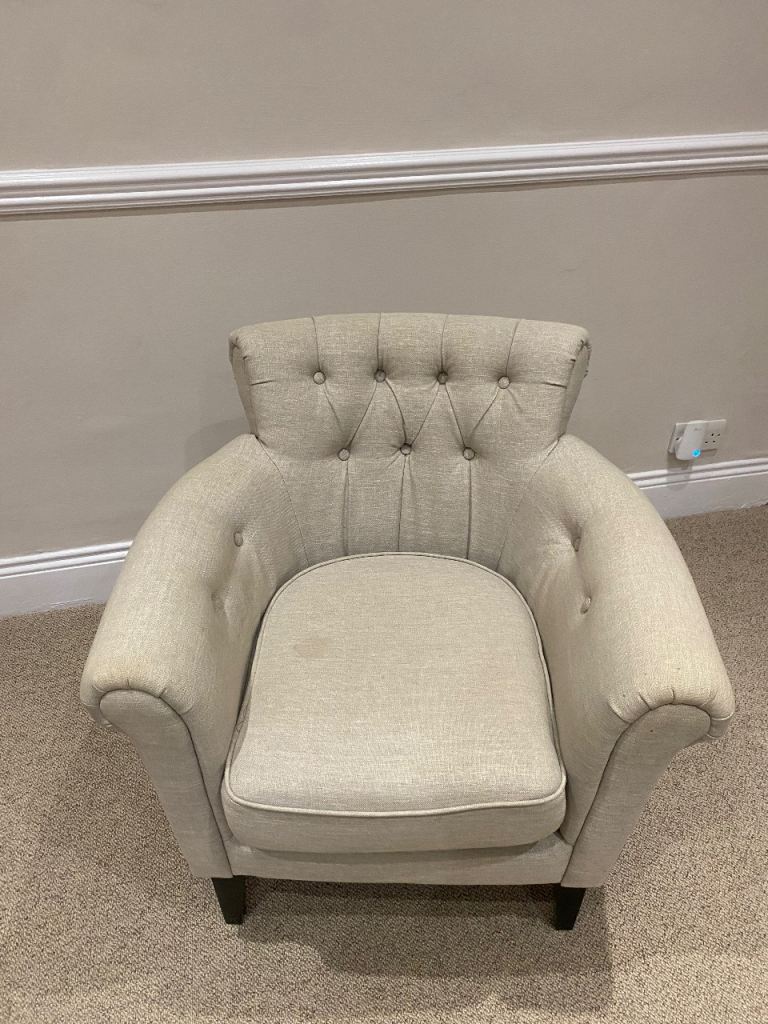 Cream/beige chair with a small stain on which could come off it cleaned 