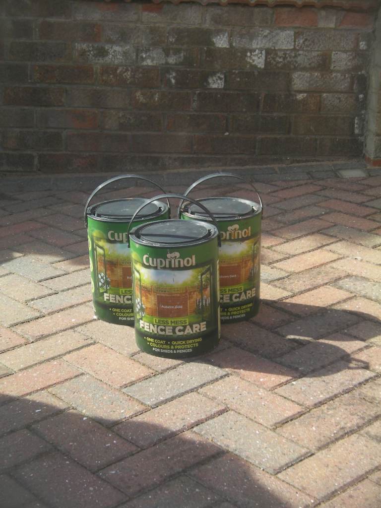 5 litre tins of Cuprinol Fence Care Stain.