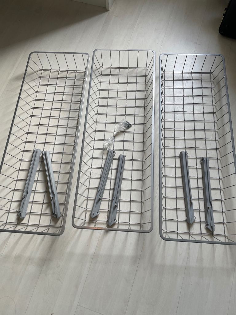 Three metal ikea storage trays