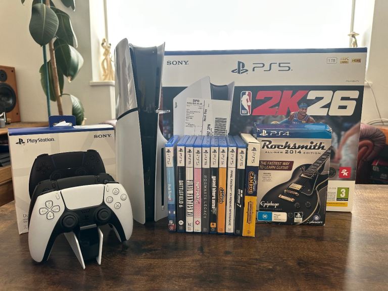 PS5 1Tb Disc with 10 Games and extra controller. Like New