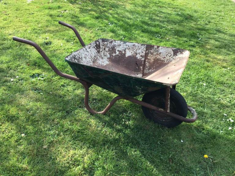 VERY old and well weathered wheelbarrow - perfect as Garden Display planter.