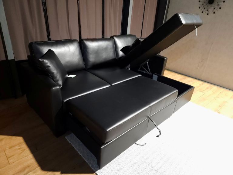 Unused faux leather corner sofa bed black.