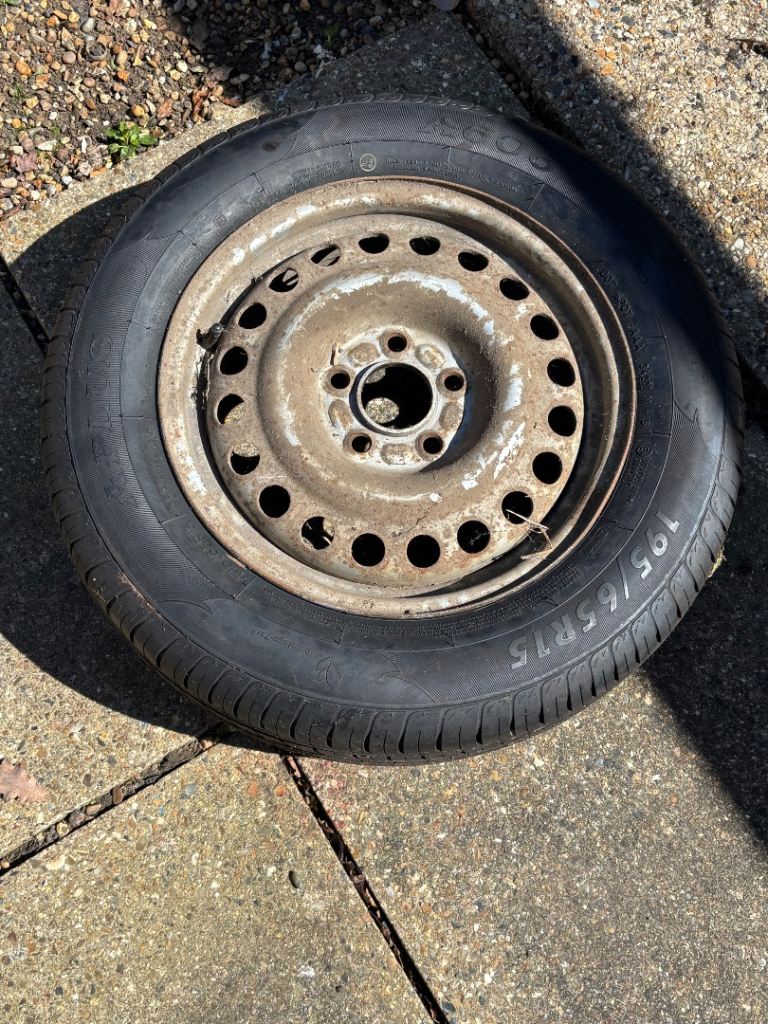 Car tyre on steel rim 