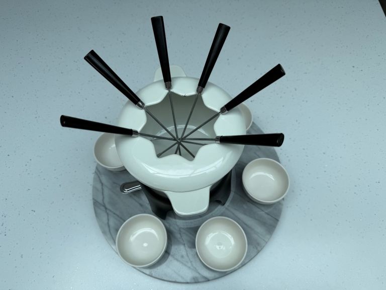 Revolving cast iron and marble fondue set
