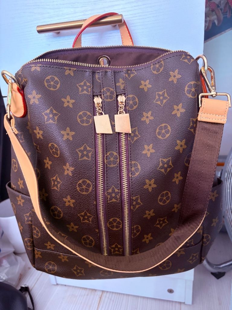 Stylish Brown Backpack with Multiple Zippers – As Good As New
