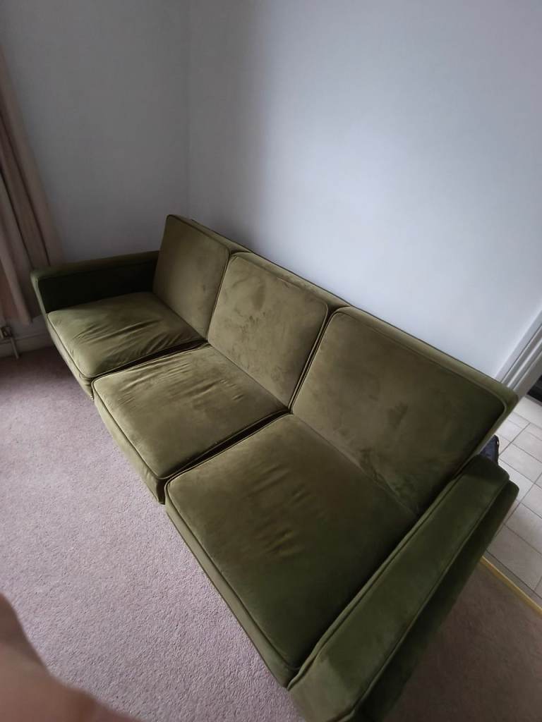Plush green click clack sofa 
