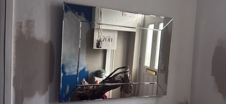 Large next bevelled mirror