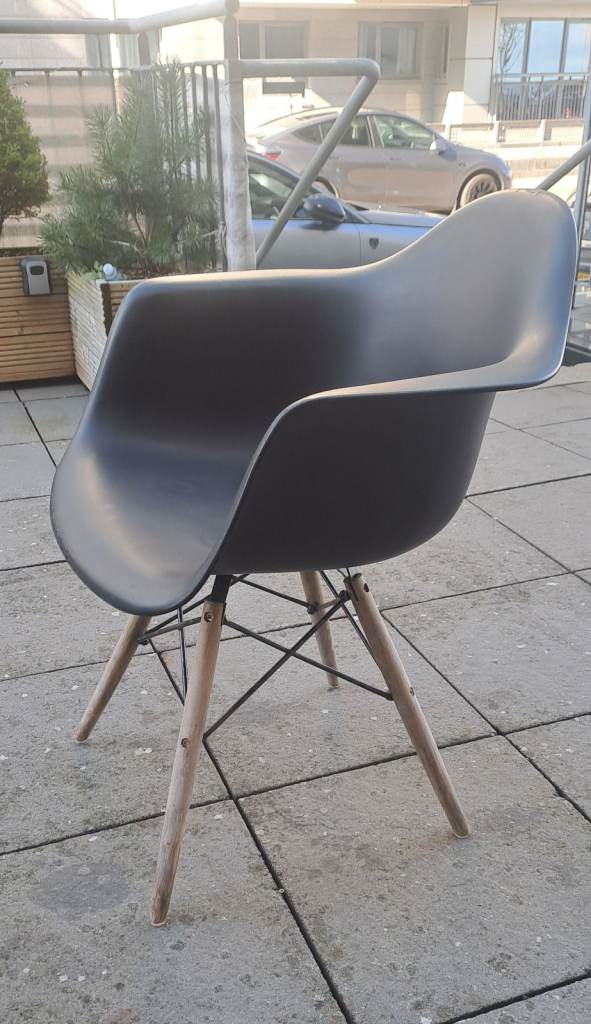 Eames style black plastic molded chair
