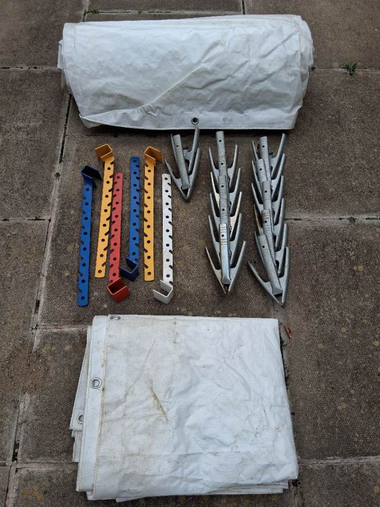 Two tarpauline sheets with metal clips/brackets