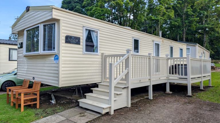 Static caravan with side decking