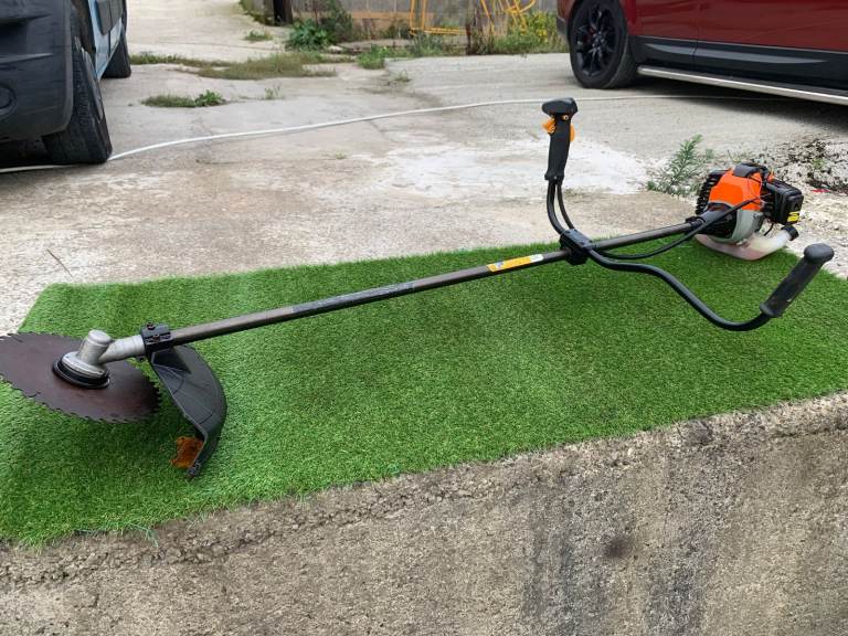 Brush Cutter, Professional Model, 52cc, 2 Stroke Engine, and Harness.