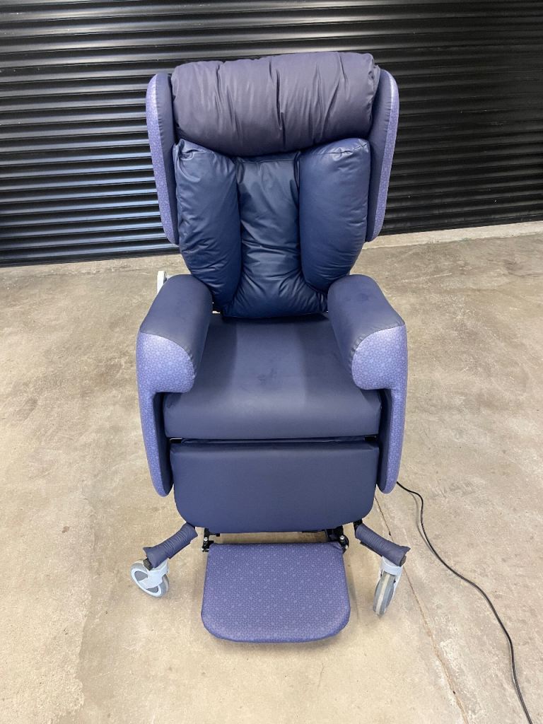 Primacare full electric Parkinsons tilt in space chair with split T back.
