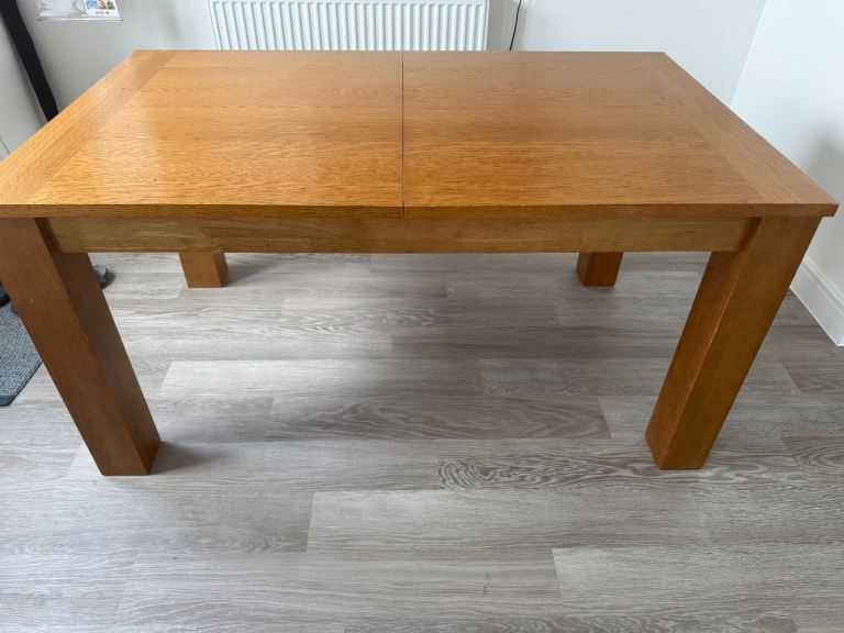 Extending solid wood dining table