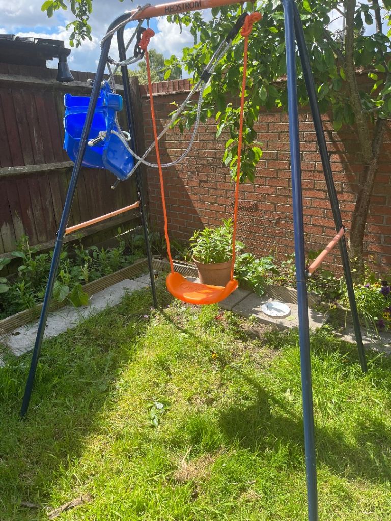 Child swing with toddler seat & frame included.