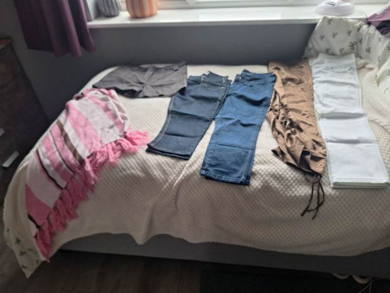 A bundle of ladies clothes shorts,3/4 trousers size12 white+gold trousers size10 + ponchosizemedium 
