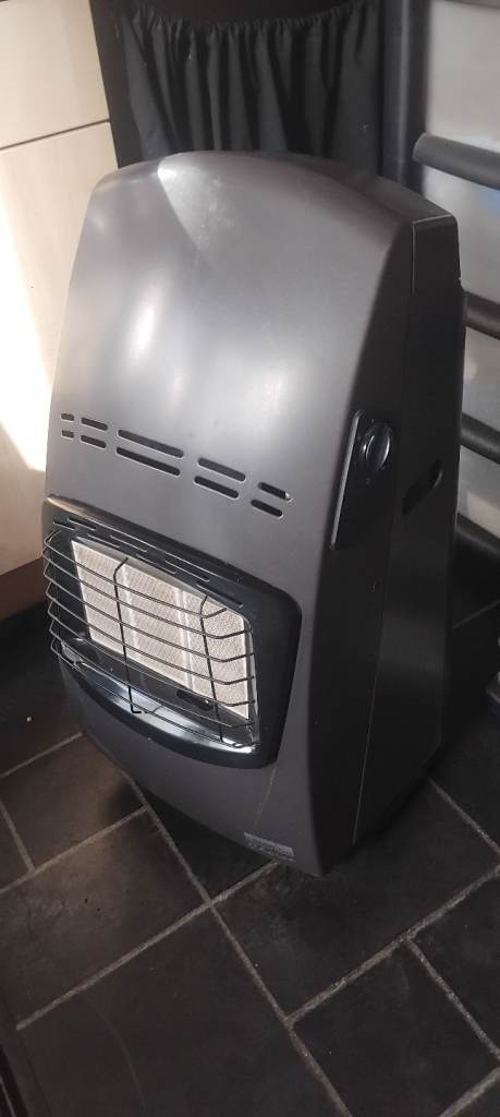 Gas heater with empty Calor gas bottle 