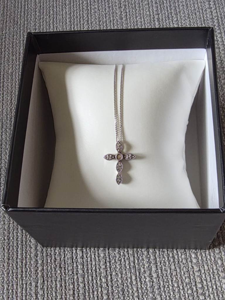 Sterling silver chain with 0.10 carrot diamond celtic design cross