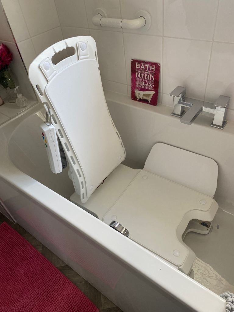 Immaculate bath chair that lowers you gently into your bath