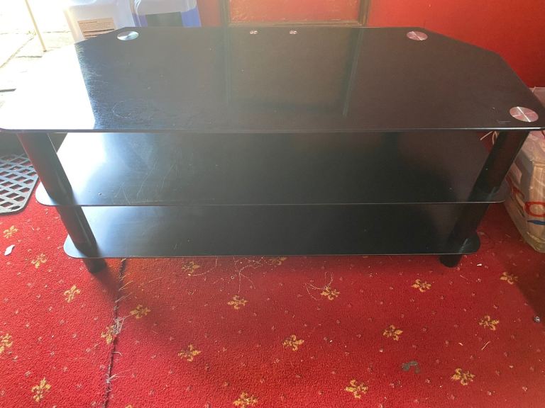 Black tv stand (price negotiable) need the money to get my tooth extracted 