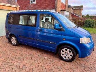 VW T5 Camper (T-PORTER T30 130 TDI SWB ) - sleeps and seats 4.
