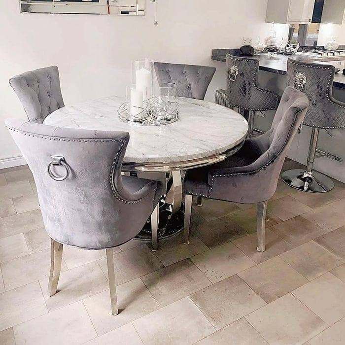 Round table with 4 chairs in grey knocker chairs, marble table