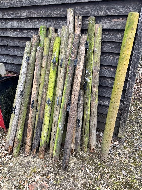 Old wooden round fence posts 