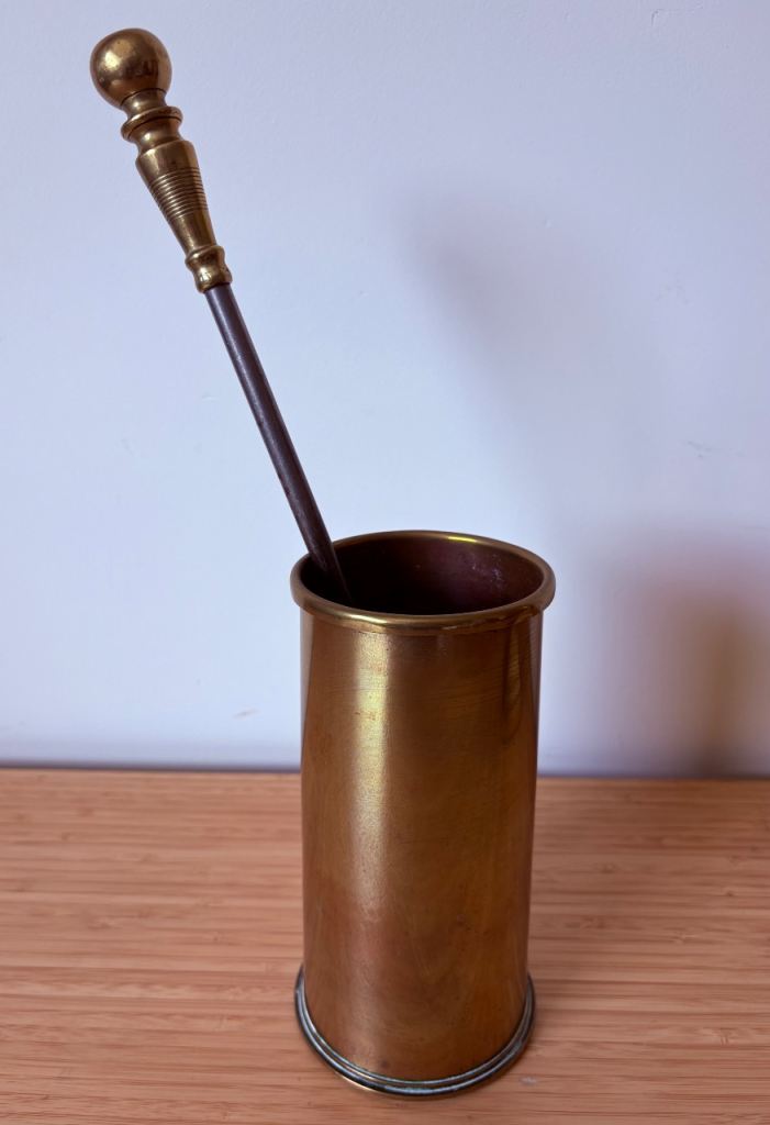 Antique Brass Handled poker in solid brass shell casing.