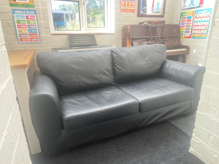 Black Leather Two-Seater Sofa – Good Condition