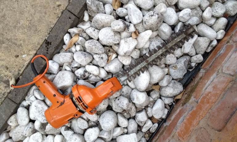 Orange Electric Hedge Trimmer – Fair Condition