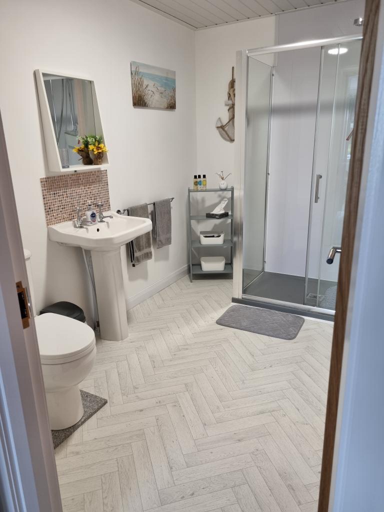 Bathroom basin, pedestal and taps.
