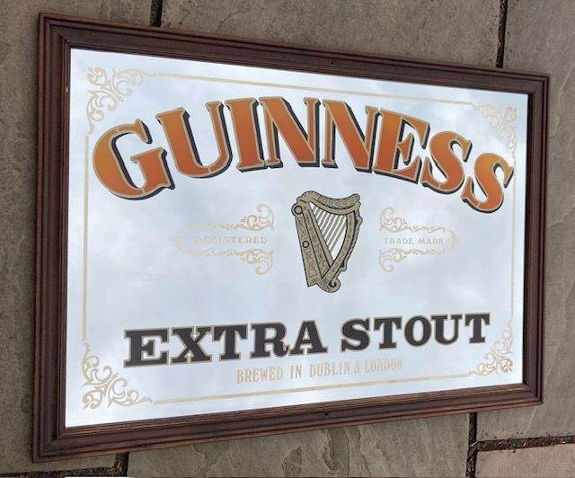 Vintage Guinness Extra Stout advertising mirror in wooden frame