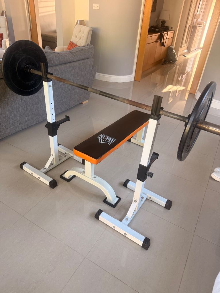 Bench and Olympic bar with weights