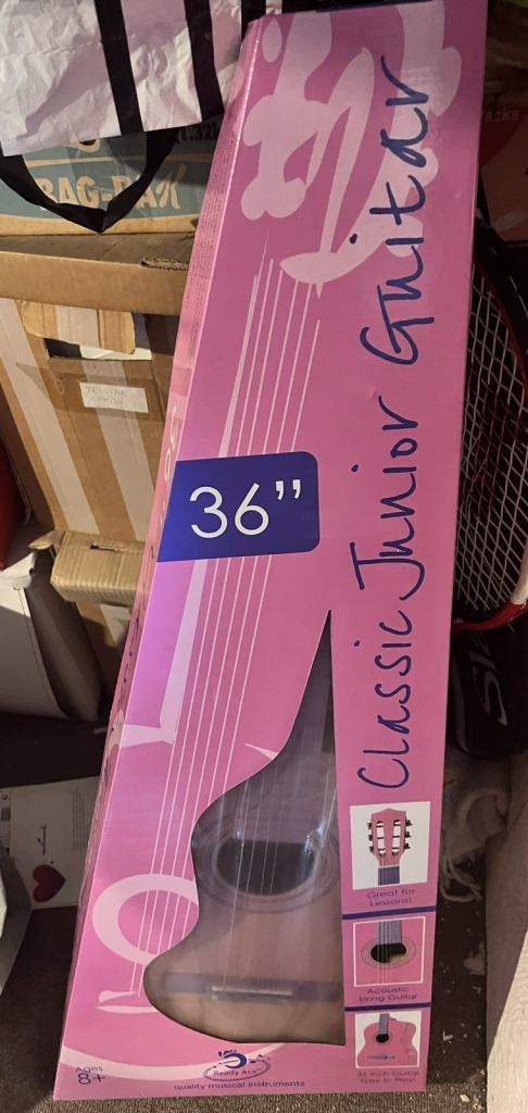 Pink guitar new in box 