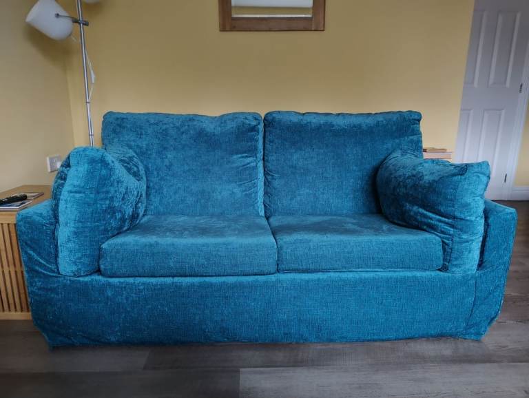 Comfortable Teal Two-Seater Sofa – Good Condition