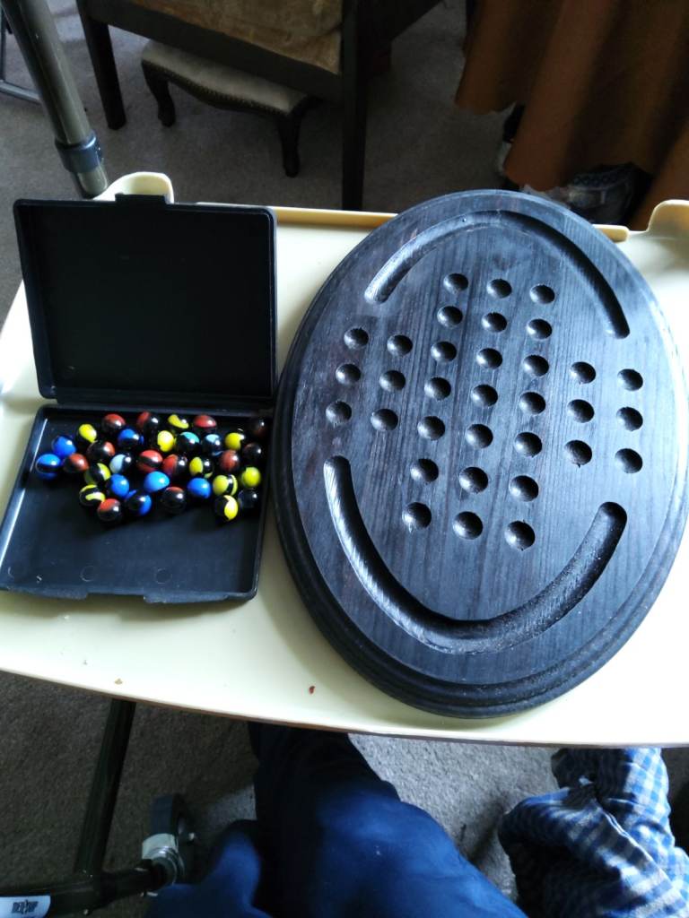 Board game solitaire with marbles