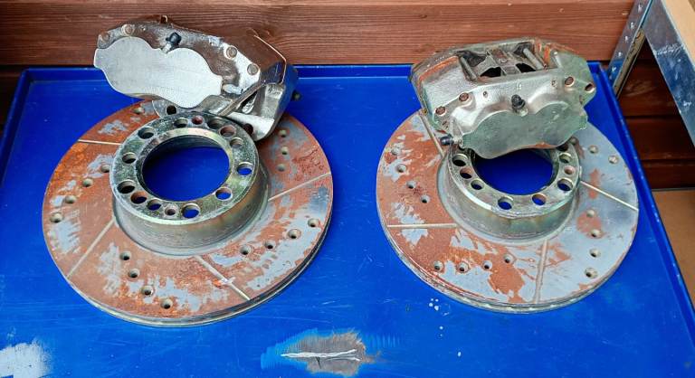 Drilled and grooved brake pads disks and calipers 