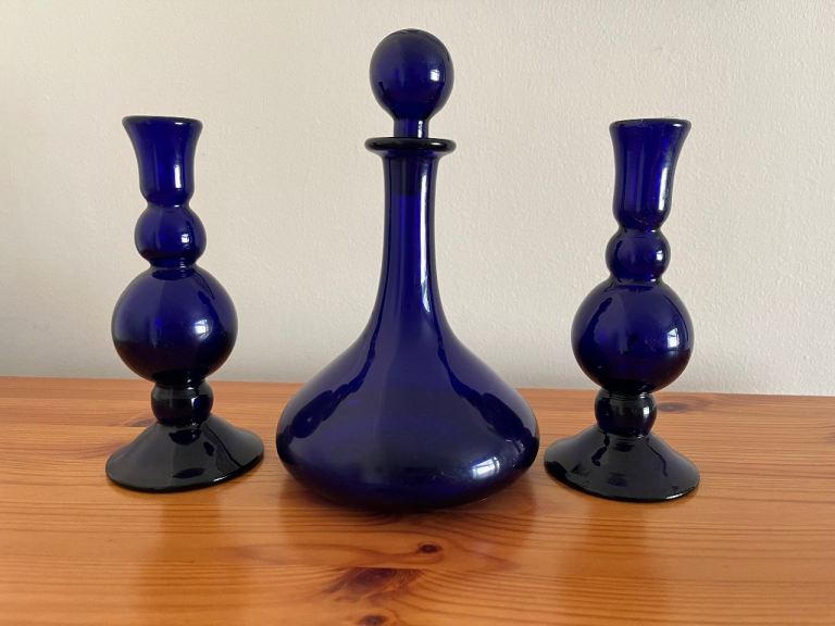 Bristol blue glass bottle and candle sticks