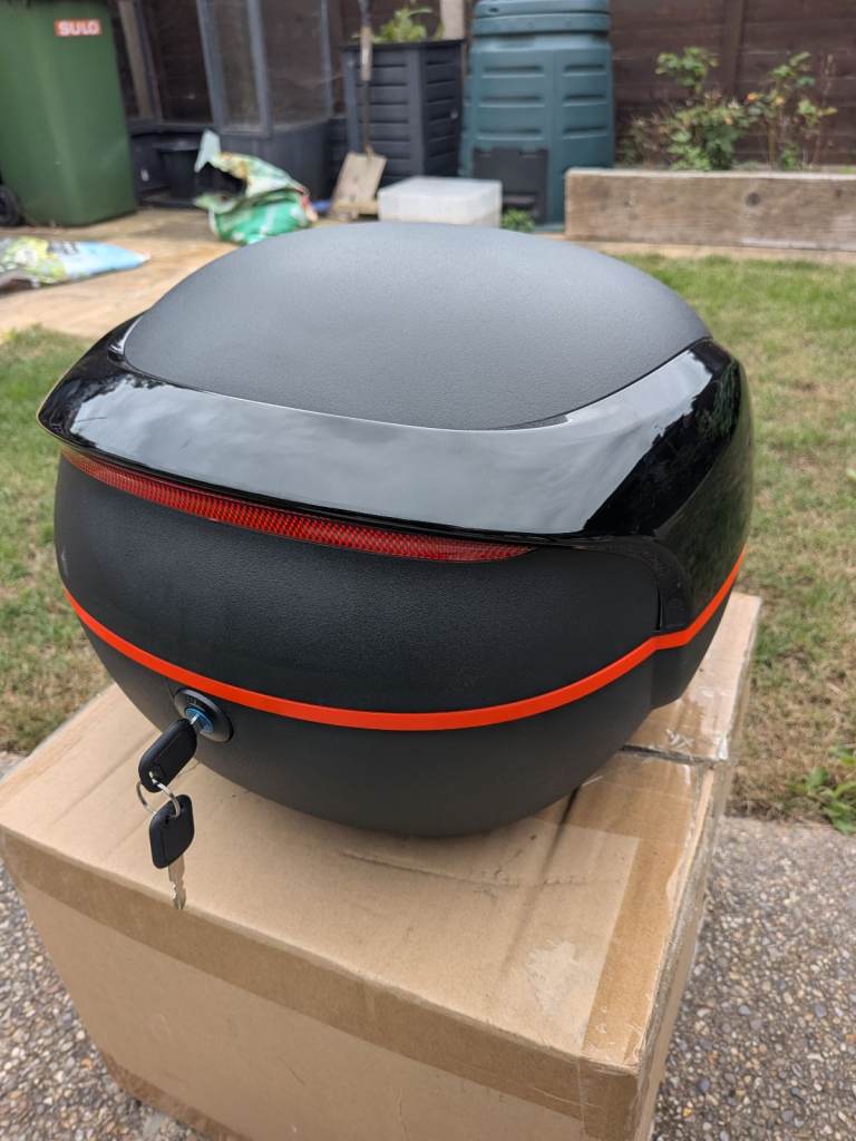 Brand new unbranded motorcycle top box with mounting fittings and key
