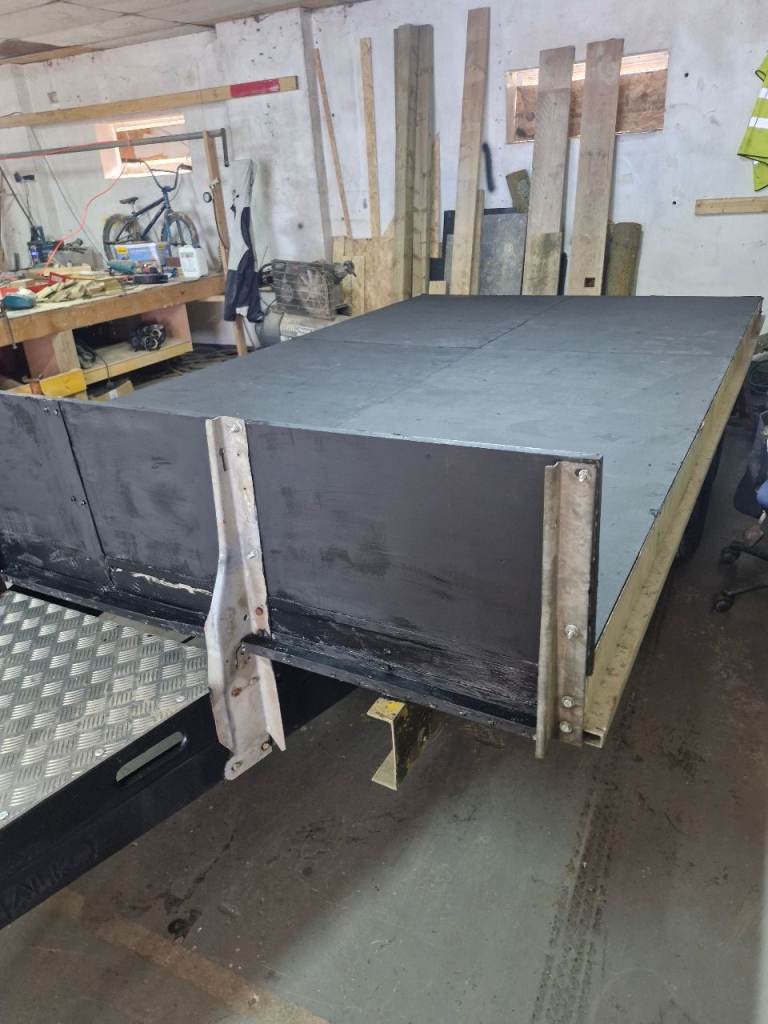 Twin axle flat bed trailer