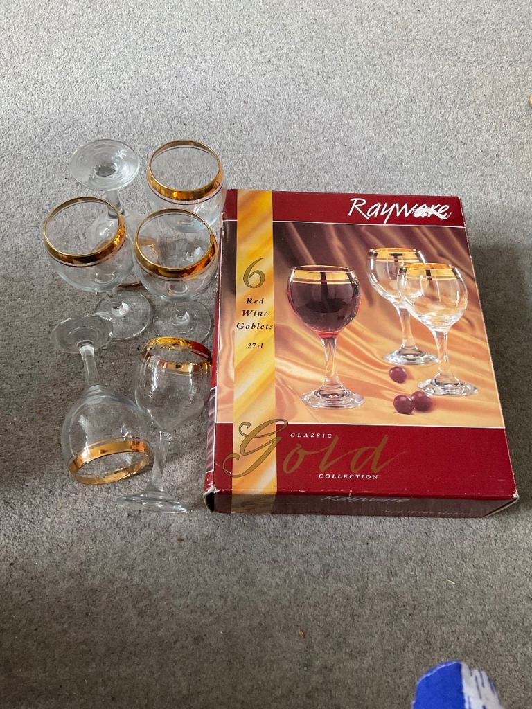 Gold rimmed red wine glasses