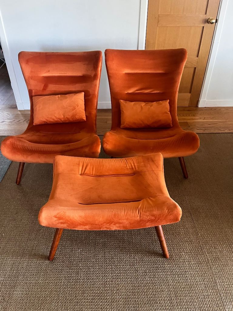 Orange chairs and footstool