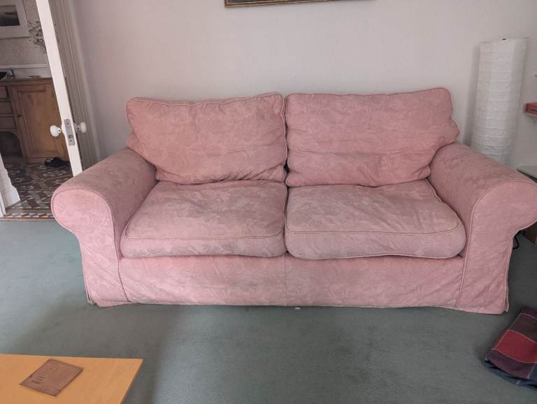 Salmon pink 3 seater sofa. Feather cushions 