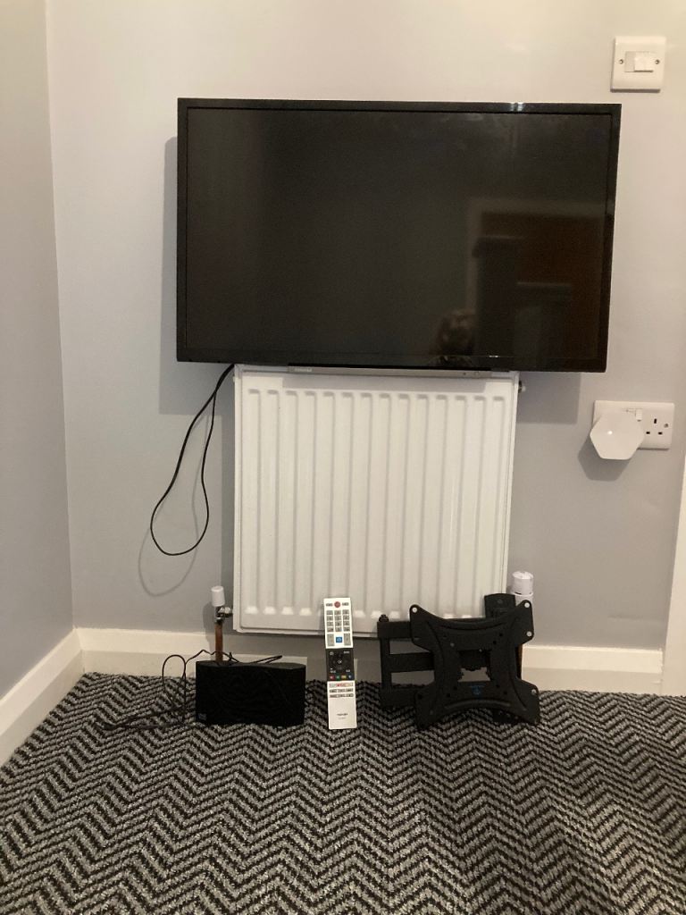 Black Smart TV with Remote and Wall Mount