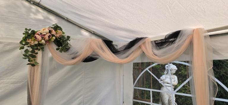 Wedding arch backdrop floral voil display.