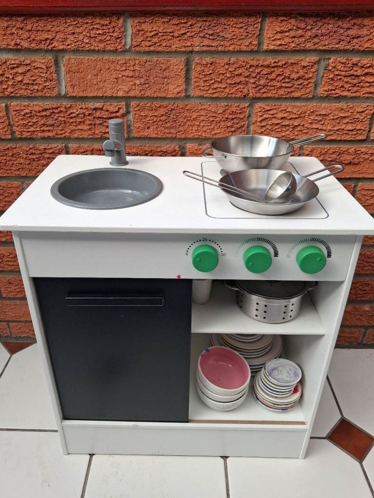 Toy kitchen with lots of accessories 